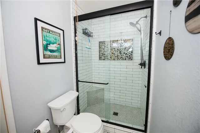 a view of a livingroom with furniture workspace and a window