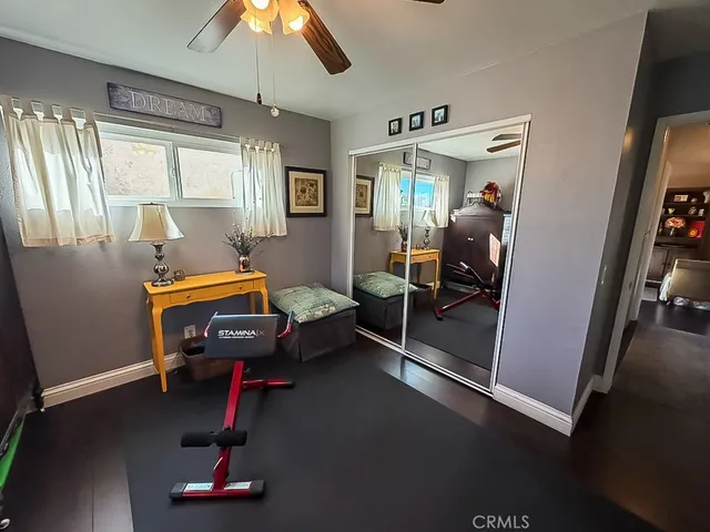 a view of a patio with table and chairs potted plants