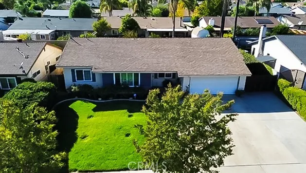 a living room with furniture a clock and a window