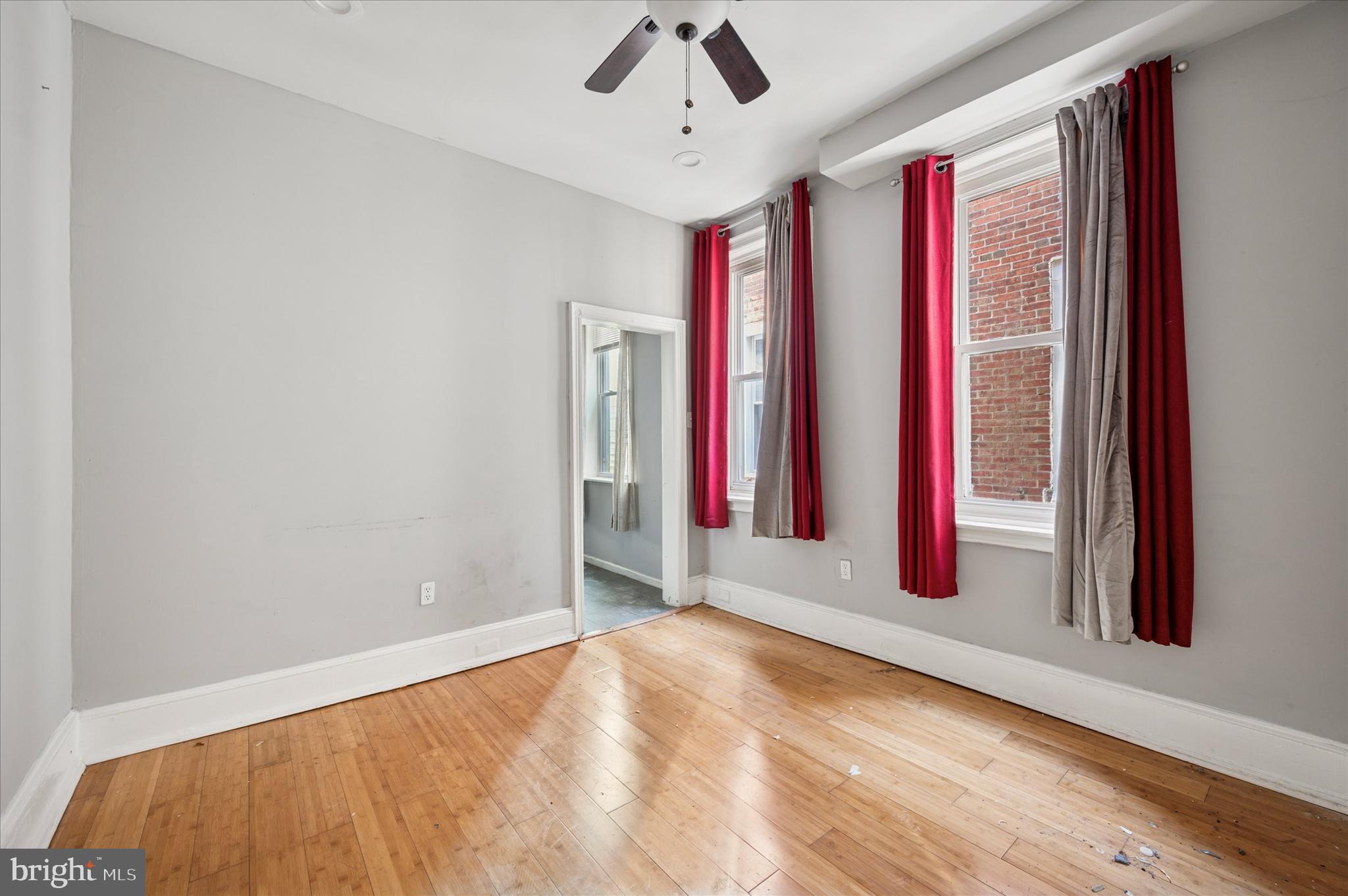 809 East Locust Avenue Philadelphia, PA 19138 - Photo 13 of 23 a view of a bedroom with wooden floor and a ceiling fan