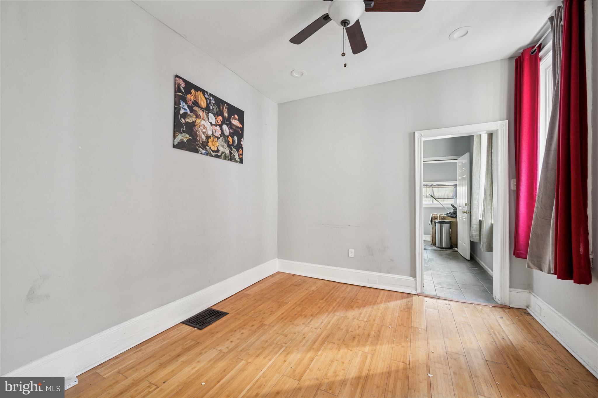 809 East Locust Avenue Philadelphia, PA 19138 - Photo 14 of 23 a view of a room with wooden floor and a ceiling fan