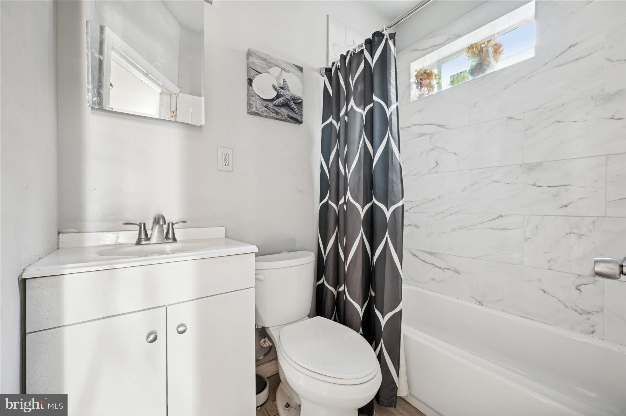809 East Locust Avenue Philadelphia, PA 19138 - Photo 18 of 23 a bathroom with a sink toilet and shower