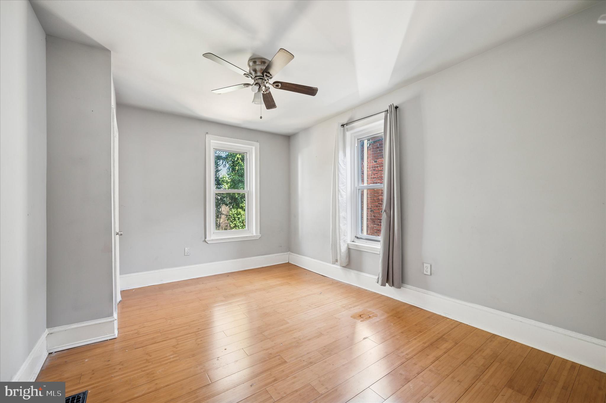 809 East Locust Avenue Philadelphia, PA 19138 - Photo 19 of 23 a view of empty room with wooden floor and fan
