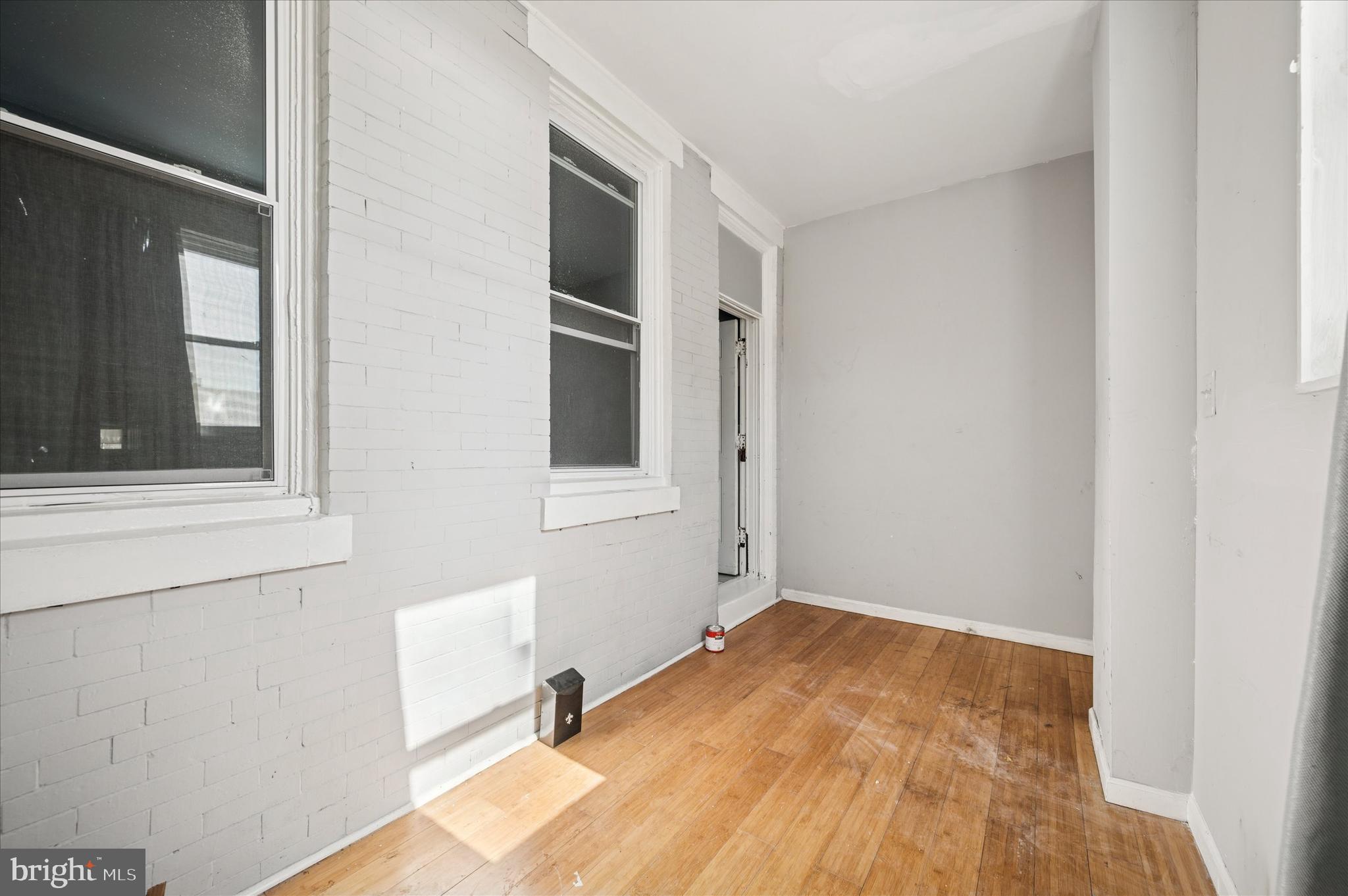 809 East Locust Avenue Philadelphia, PA 19138 - Photo 5 of 23 a view of a room with a wooden floor and a window