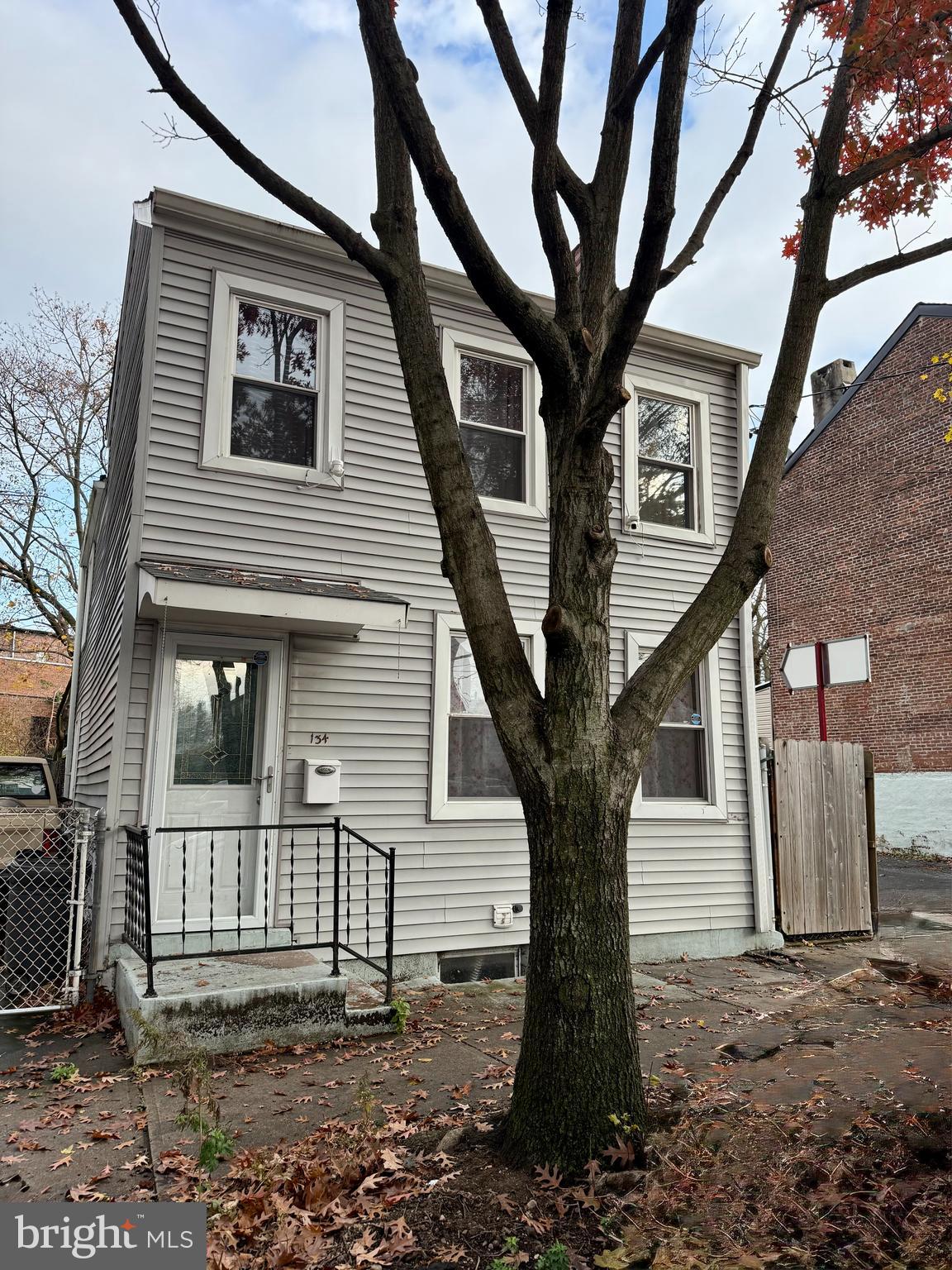 134 Second Street Trenton, NJ 08611 - Photo 1 of 2 a view of a house with a tree