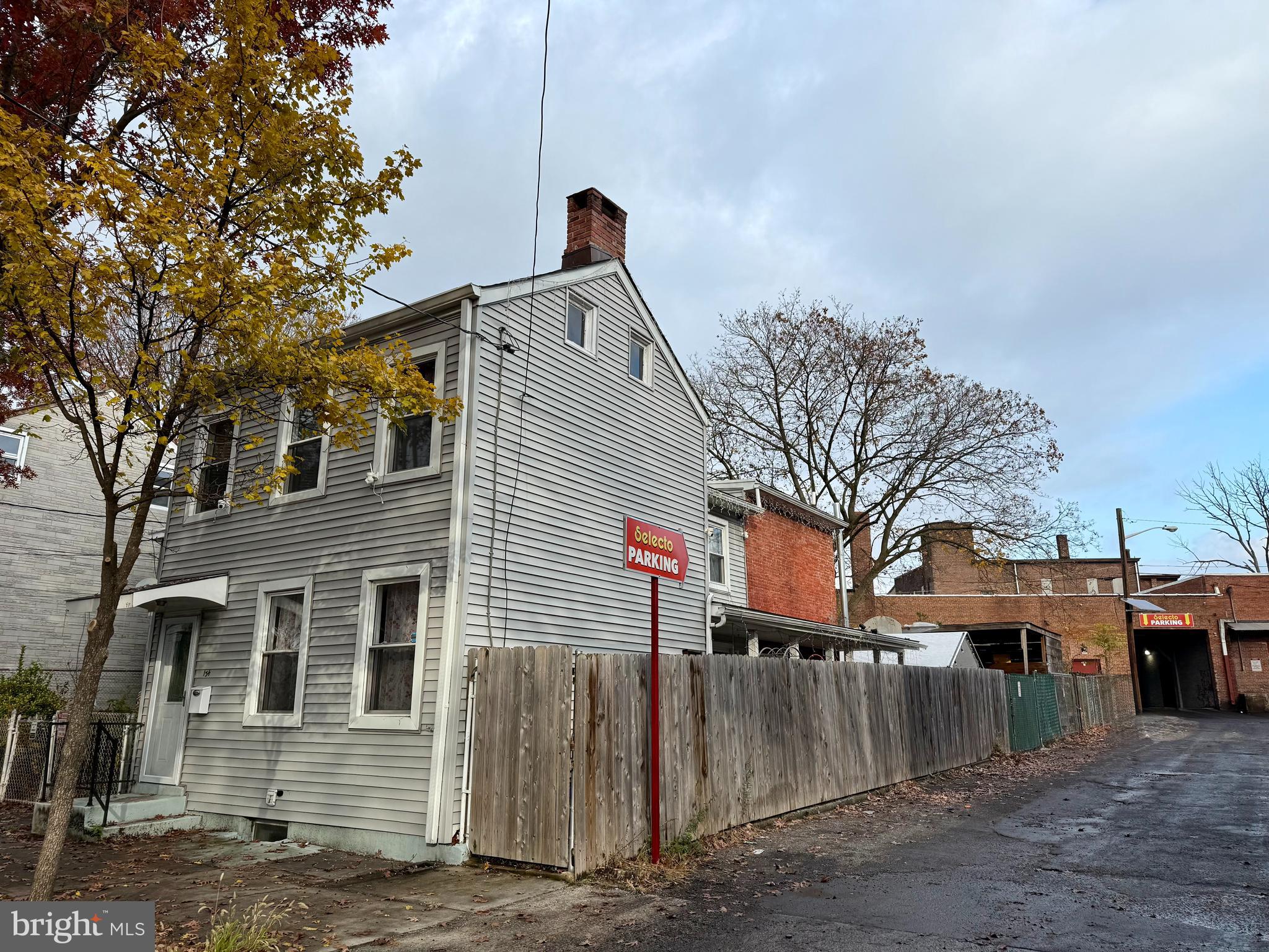 134 Second Street Trenton, NJ 08611 - Photo 2 of 2 a front view of a house with a yard