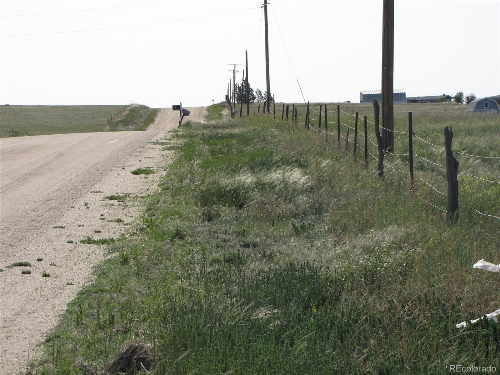 31755 Vorenberg Road Calhan, CO 80808 - Photo 7 of 10 a view of a road with a yard