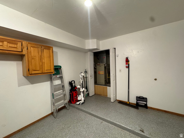 3439 Westwater Road Moab, UT 84532 - Photo 27 of 64 Finished garage featuring baseboards and e-charger
