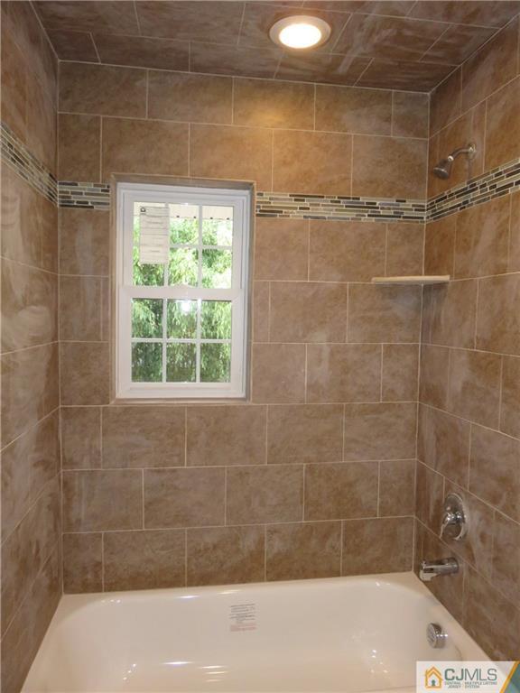 12 Gurley Road Edison, NJ 08817 - Photo 8 of 13 a bathroom with a shower and a bathtub