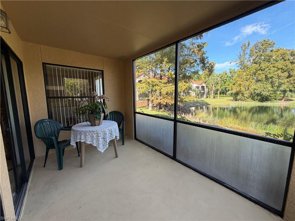 2070 Arbour Walk Circle, Unit 3214 Naples, FL 34109 - Photo 10 of 12 a room with furniture and a window