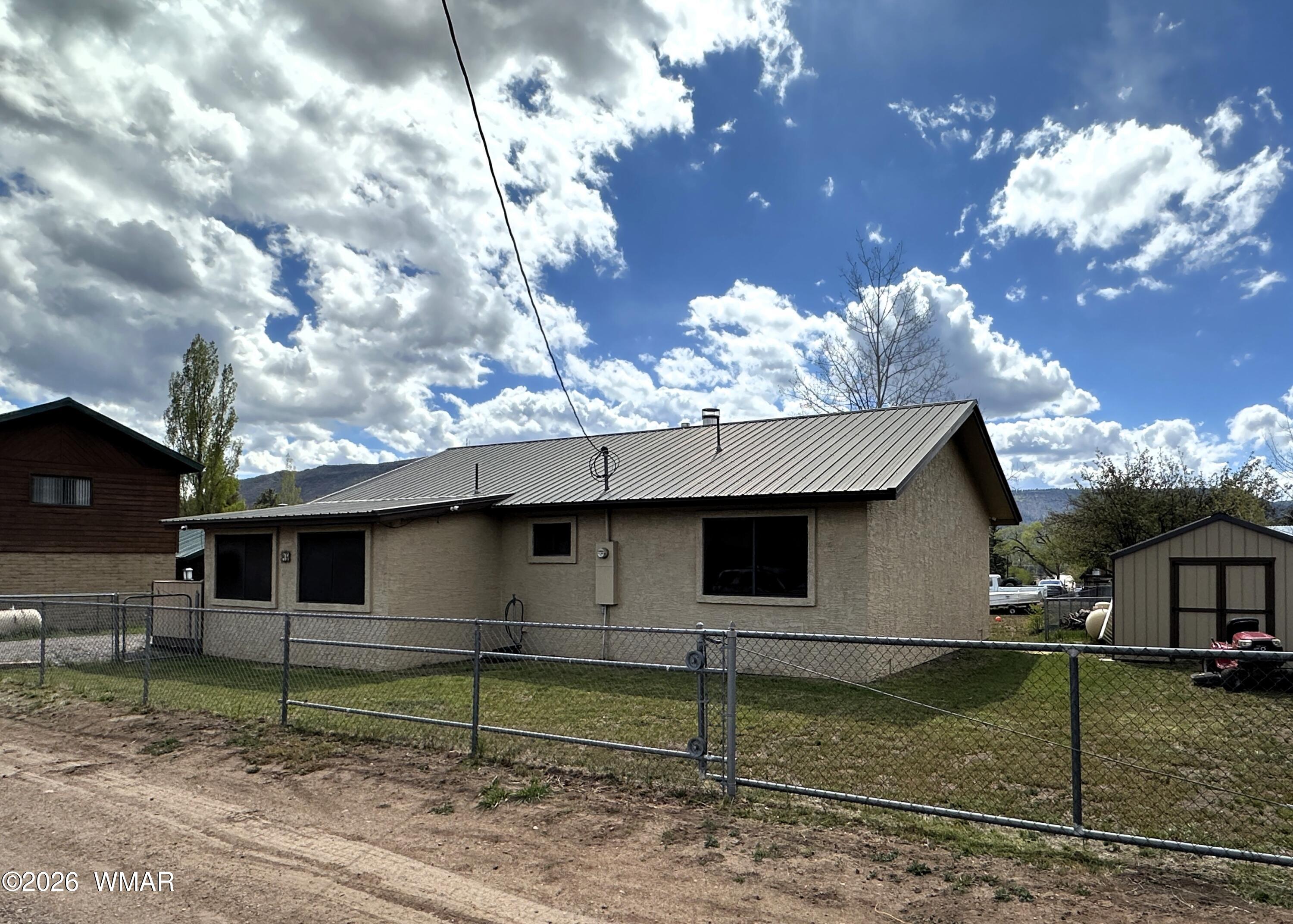 19 County Road Alpine, AZ 85920 - Photo 20 of 27 a view of a house with a yard