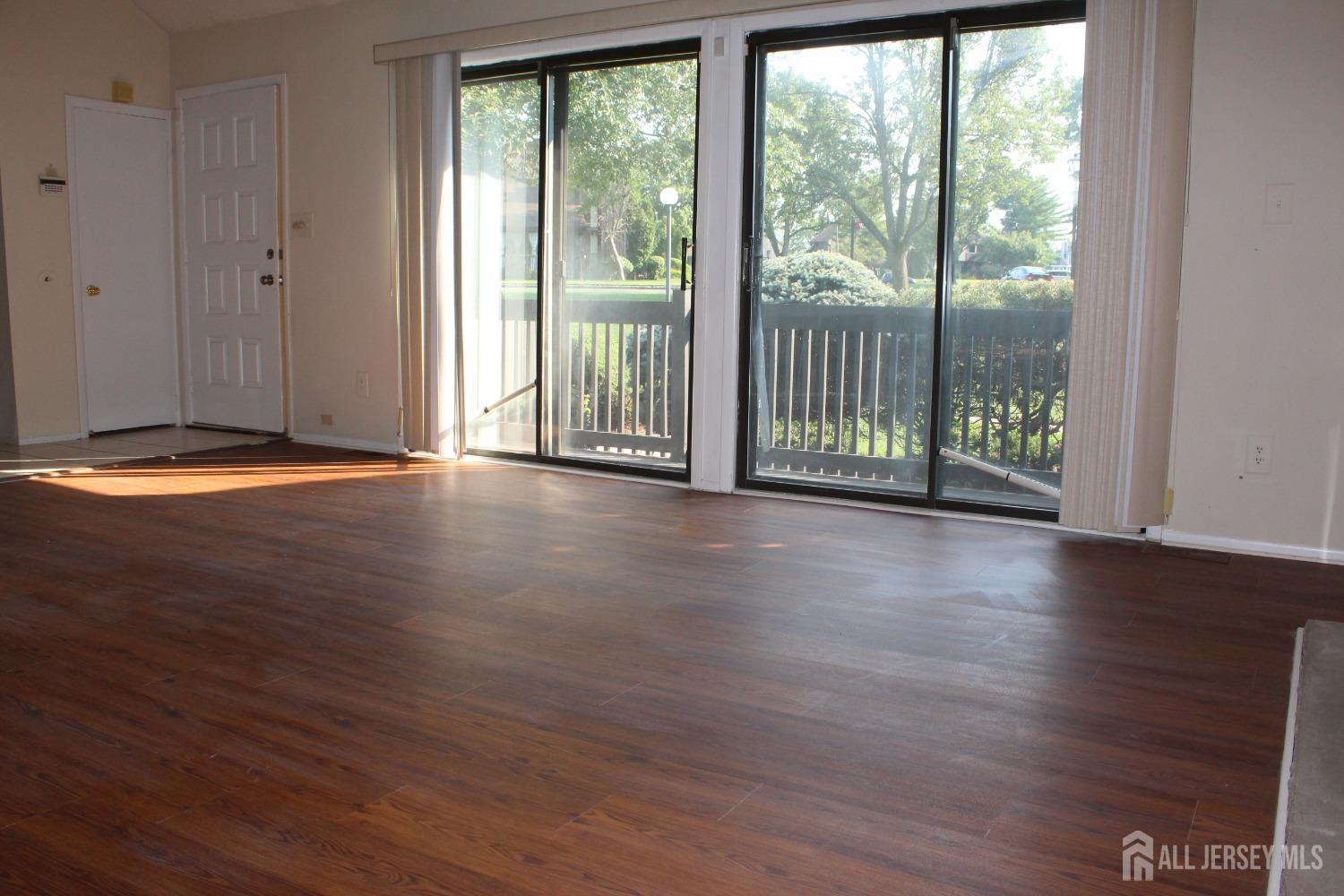 157 Westgate Drive Edison, NJ 08820 - Photo 16 of 40 a view of a room with wooden floor and doors