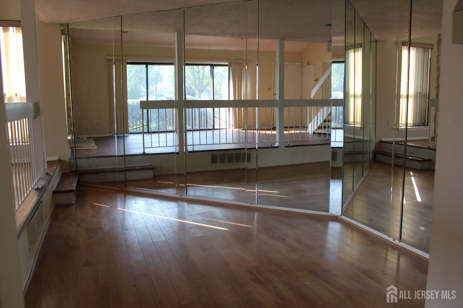157 Westgate Drive Edison, NJ 08820 - Photo 20 of 40 a view of empty room with wooden floor and fan