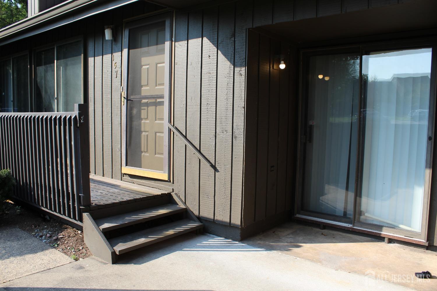 157 Westgate Drive Edison, NJ 08820 - Photo 2 of 40 a view of backyard with wooden floor and fence