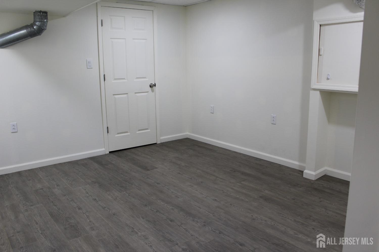 157 Westgate Drive Edison, NJ 08820 - Photo 21 of 40 wooden floor in an empty room