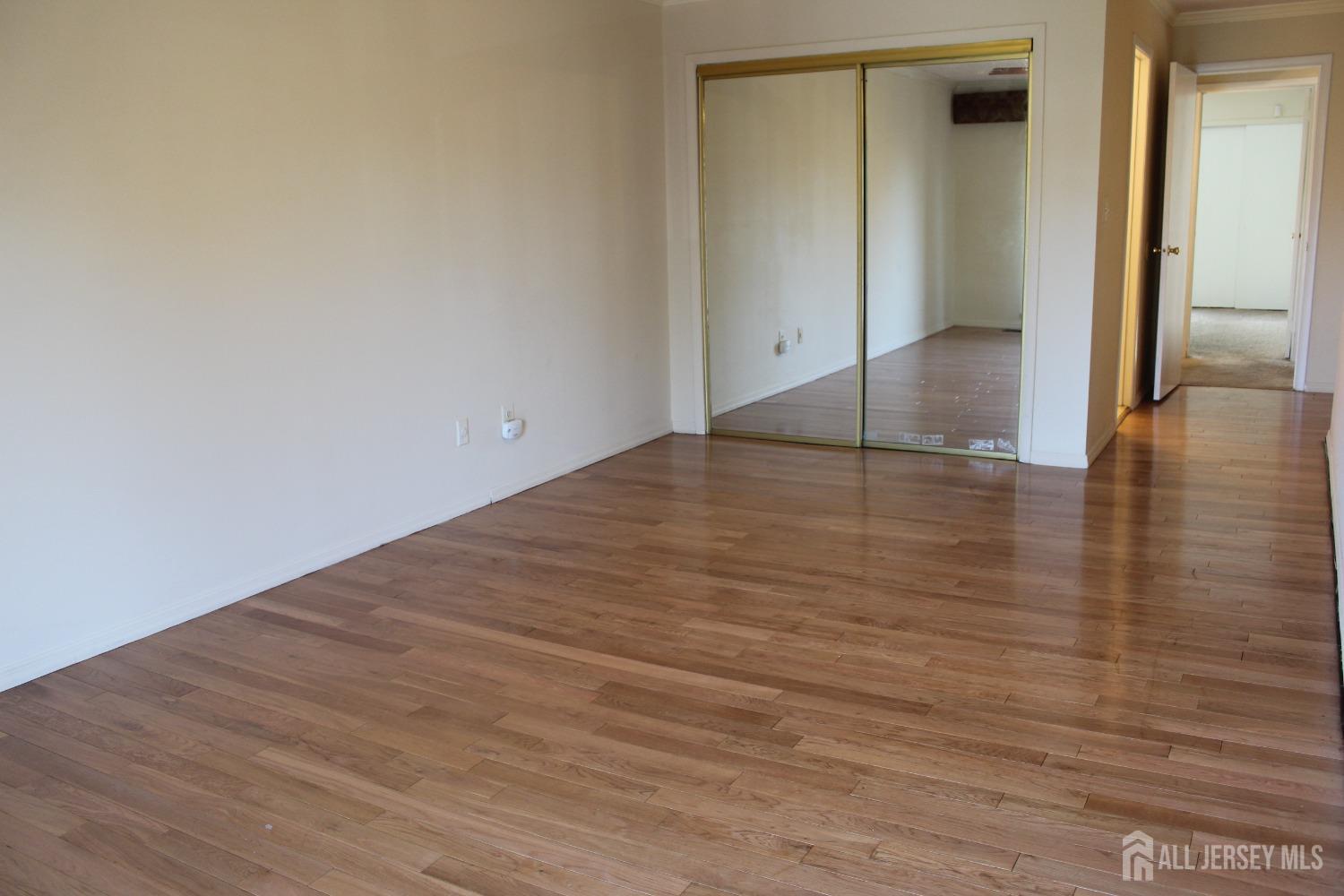 157 Westgate Drive Edison, NJ 08820 - Photo 30 of 40 a view of empty room with wooden floor