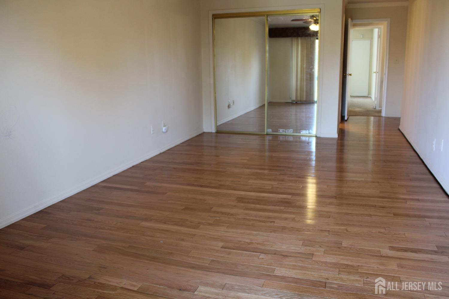 157 Westgate Drive Edison, NJ 08820 - Photo 31 of 40 a view of a hallway with wooden floor