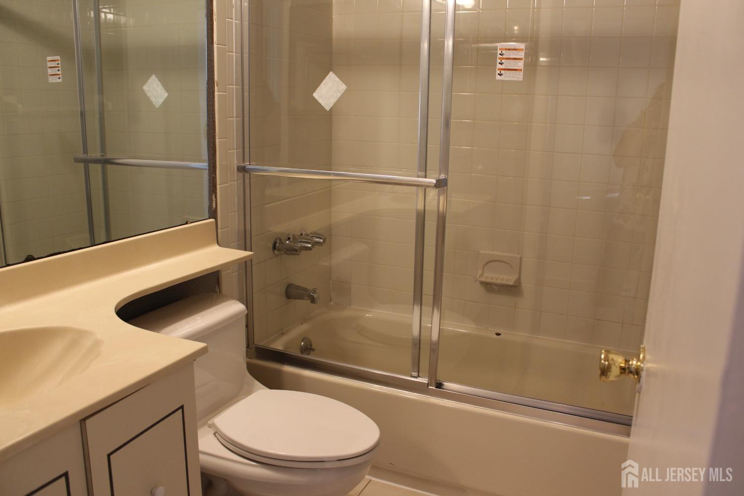 157 Westgate Drive Edison, NJ 08820 - Photo 33 of 40 a bathroom with a shower a toilet and a sink