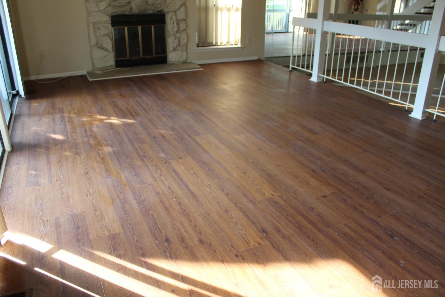 157 Westgate Drive Edison, NJ 08820 - Photo 34 of 40 a view of a livingroom with wooden floor and a window