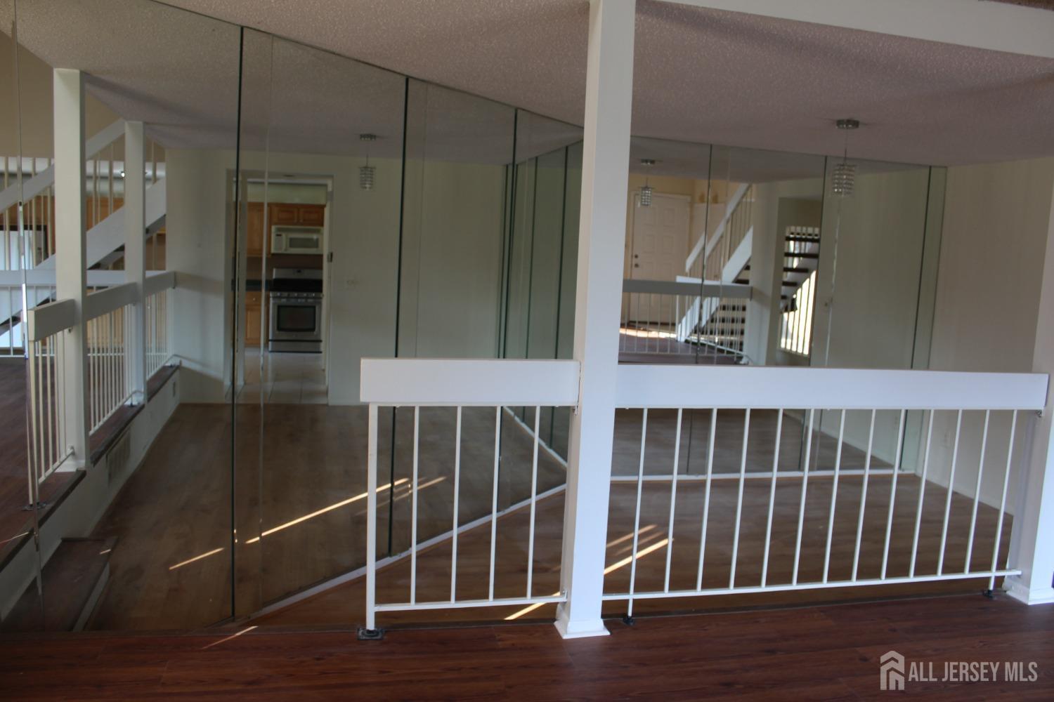 157 Westgate Drive Edison, NJ 08820 - Photo 37 of 40 a view of balcony with wooden floor