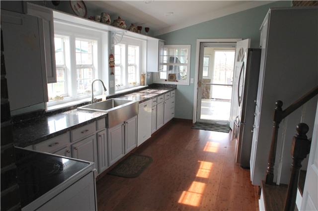 7470 Shoals Branch Road Primm Springs, TN 38476 - Photo 2 of 12 a large kitchen with a large window