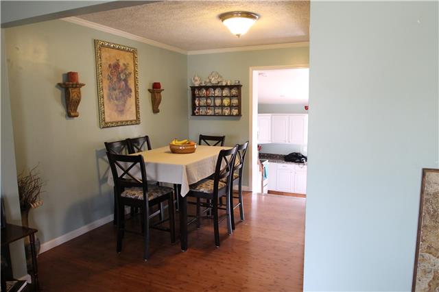 7470 Shoals Branch Road Primm Springs, TN 38476 - Photo 4 of 12 a view of a dining room with furniture
