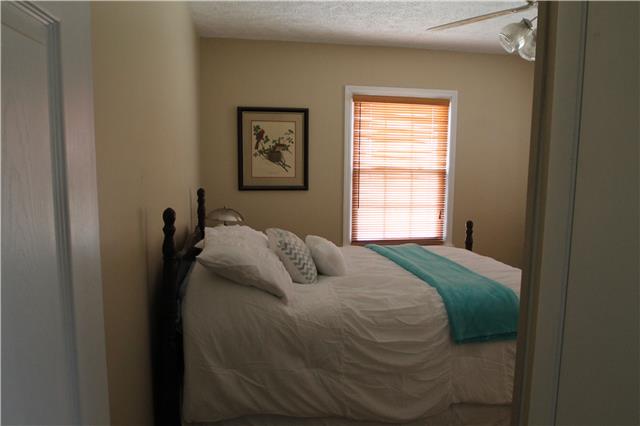7470 Shoals Branch Road Primm Springs, TN 38476 - Photo 6 of 12 a bedroom with a bed and a window