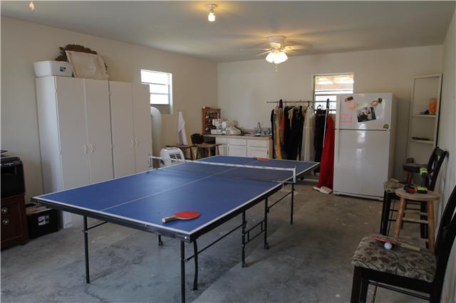 7470 Shoals Branch Road Primm Springs, TN 38476 - Photo 8 of 12 a room with furniture pool table and flat screen tv