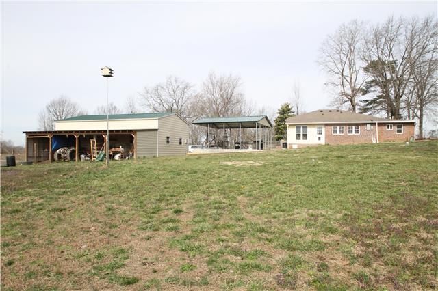 7470 Shoals Branch Road Primm Springs, TN 38476 - Photo 9 of 12 a front view of a house with a yard