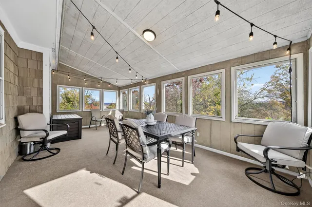 a view of a dining room with furniture window and outside view
