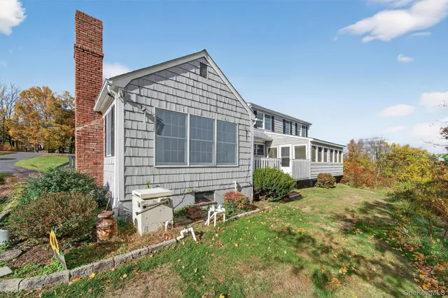 a view of a big yard with a house in the background
