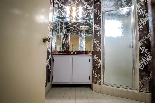 a bathroom with a sink and mirror