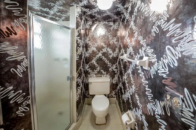 a bathroom with a toilet and a sink