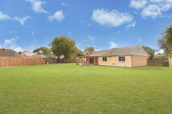a view of a house with a big yard