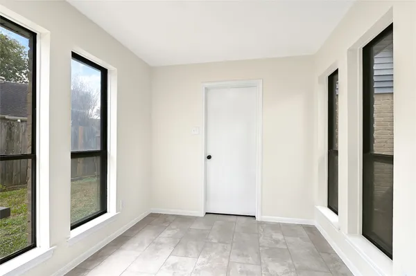 an empty room with windows