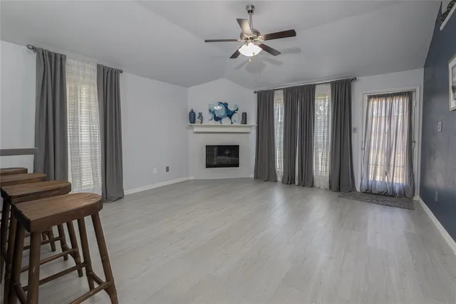 a view of an empty room with a fireplace