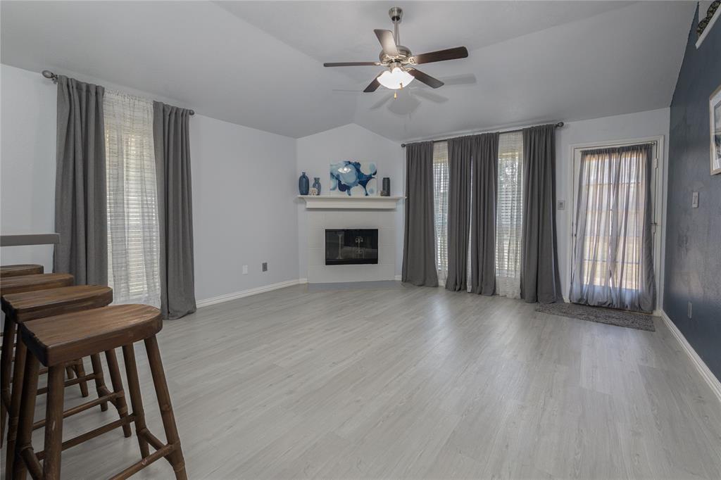 7313 Diamond Springs Trail Fort Worth, TX 76123 - Photo 15 of 40 a view of an empty room with a fireplace and a window