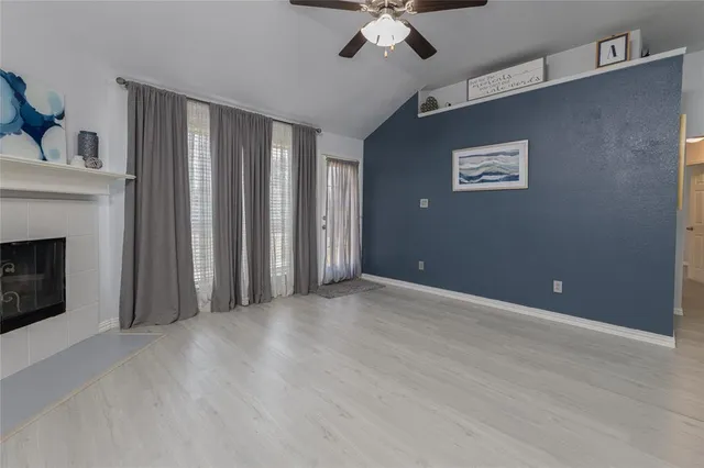 a view of a livingroom with furniture and wooden floor