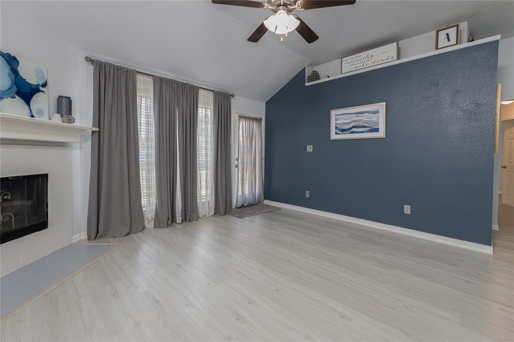 7313 Diamond Springs Trail Fort Worth, TX 76123 - Photo 16 of 40 a view of an empty room with a fireplace