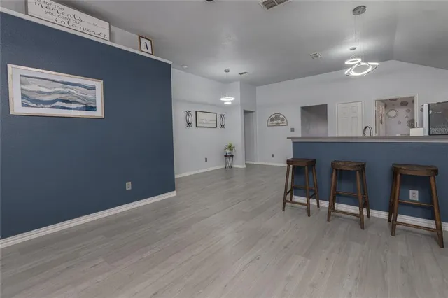a view of a dining room with furniture window and flowerpot