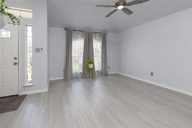 a bedroom with bed and a potted plant