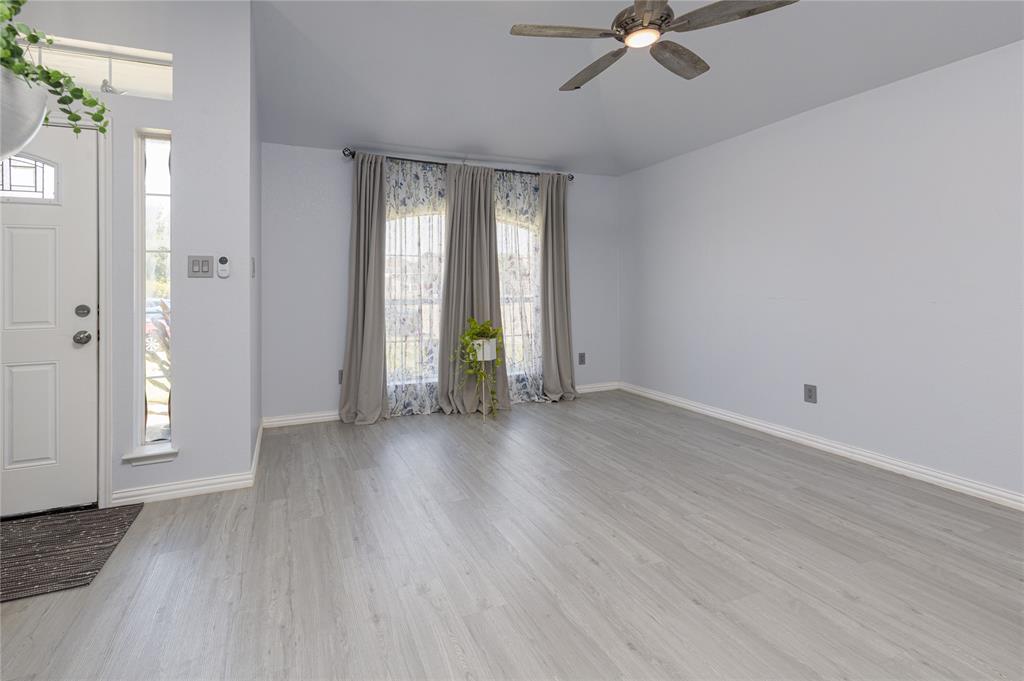 7313 Diamond Springs Trail Fort Worth, TX 76123 - Photo 21 of 40 wooden floor in an empty room with a window