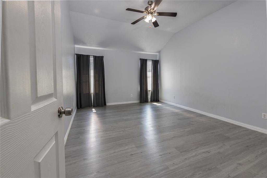 7313 Diamond Springs Trail Fort Worth, TX 76123 - Photo 23 of 40 wooden floor in an empty room with a window