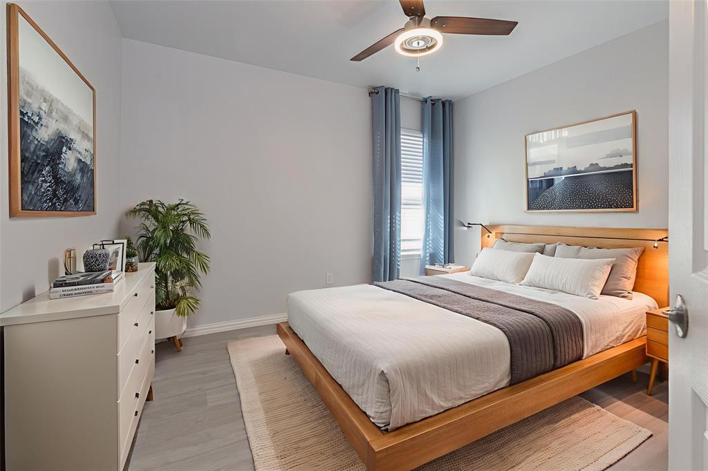 7313 Diamond Springs Trail Fort Worth, TX 76123 - Photo 24 of 40 a bedroom with a bed and a potted plant