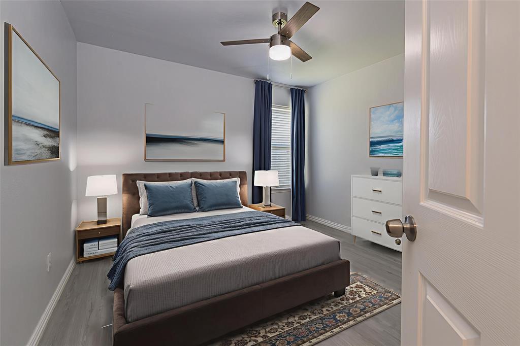 7313 Diamond Springs Trail Fort Worth, TX 76123 - Photo 26 of 40 a bedroom with a bed and a chandelier