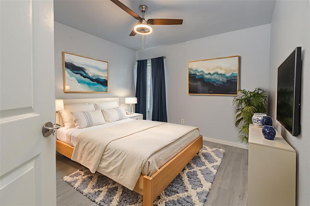 7313 Diamond Springs Trail Fort Worth, TX 76123 - Photo 28 of 40 a bedroom with a bed and a flat screen tv