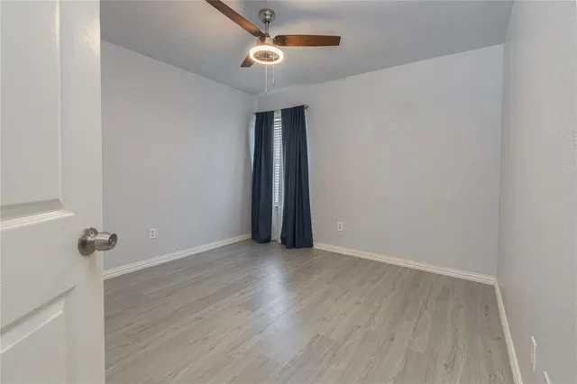 a view of a bathroom from the hallway