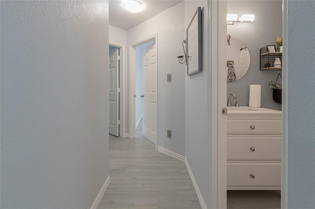 7313 Diamond Springs Trail Fort Worth, TX 76123 - Photo 30 of 40 a view of a bathroom from the hallway