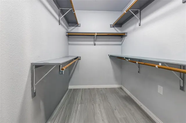 a view of an entryway with wooden floor