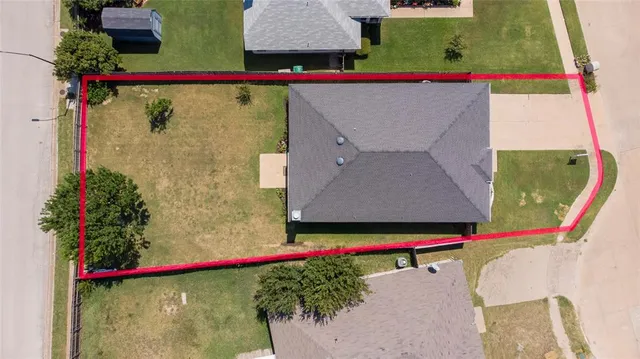an aerial view of a house with swimming pool
